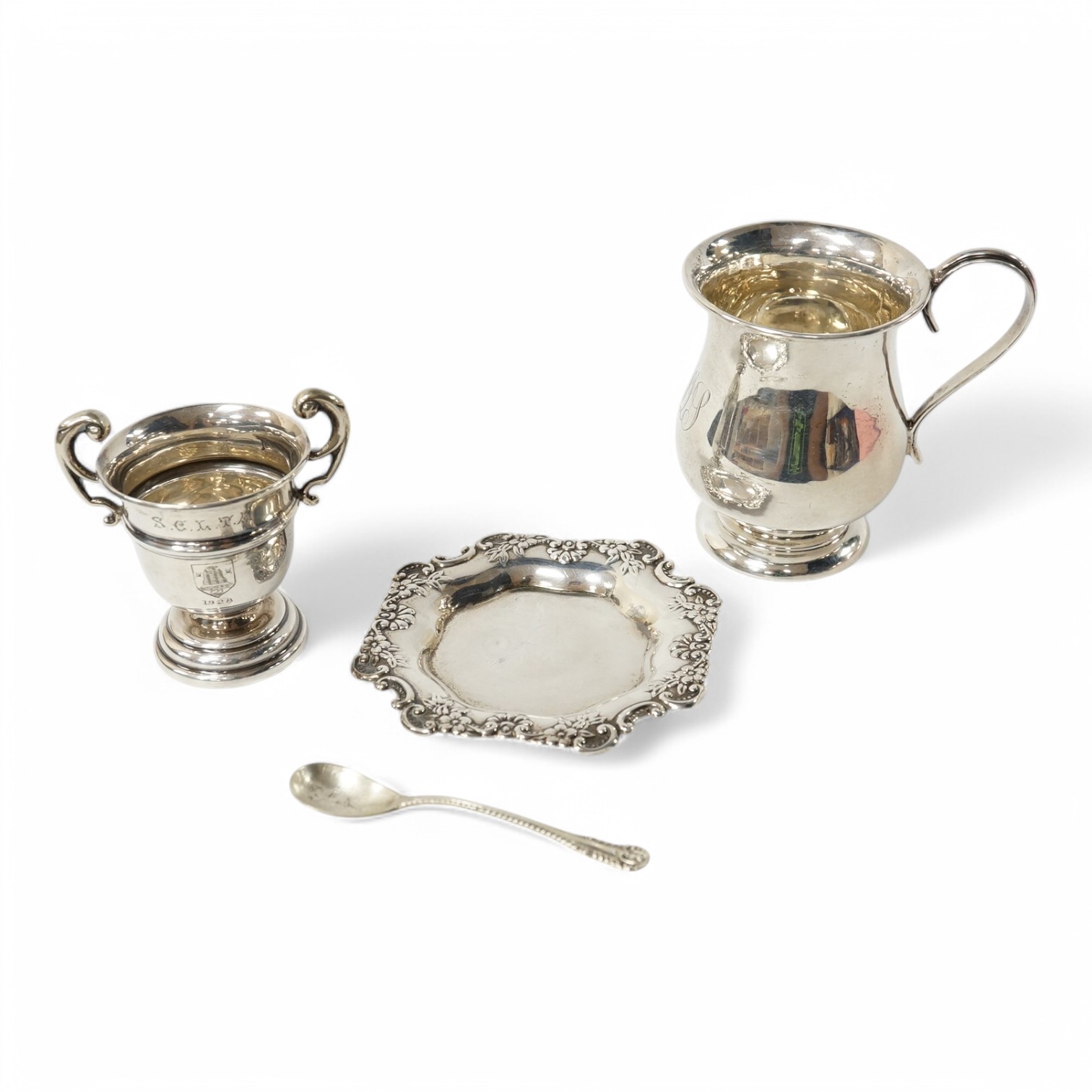 An Edwardian small silver baluster mug, Robert Pringle & Sons, Chester, 1906, 78mm, together with small silver trophy cup, a sterling pin tray and a silver condiment spoon. Condition - fair